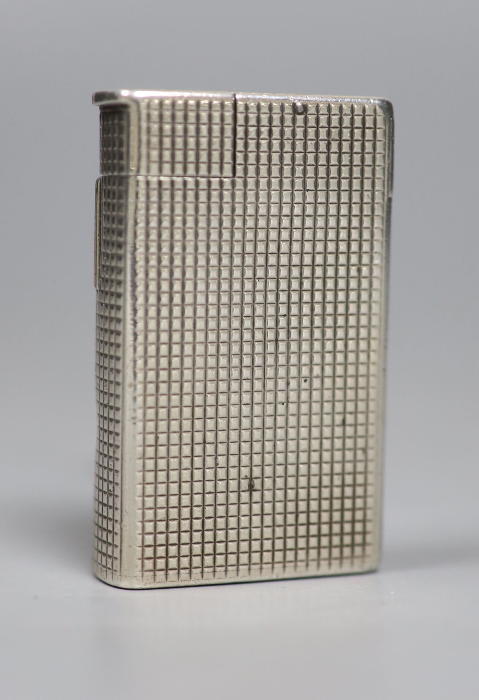 An early 1960s silver Dunhill lighter, 54mm.